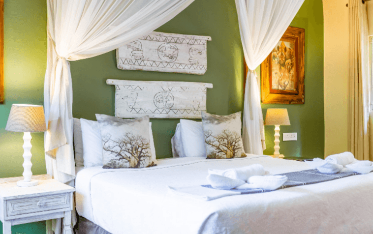 Double room with green feature wall at Bayete Guest Lodge