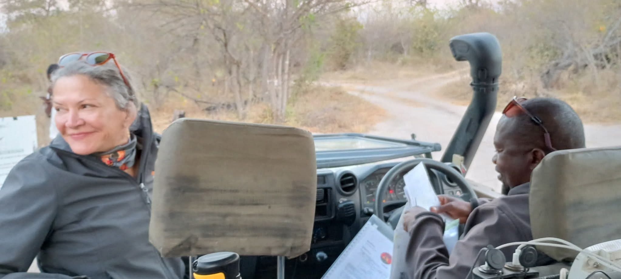 Donna and KT in the safari vehicle on the road through the Botswana bush
