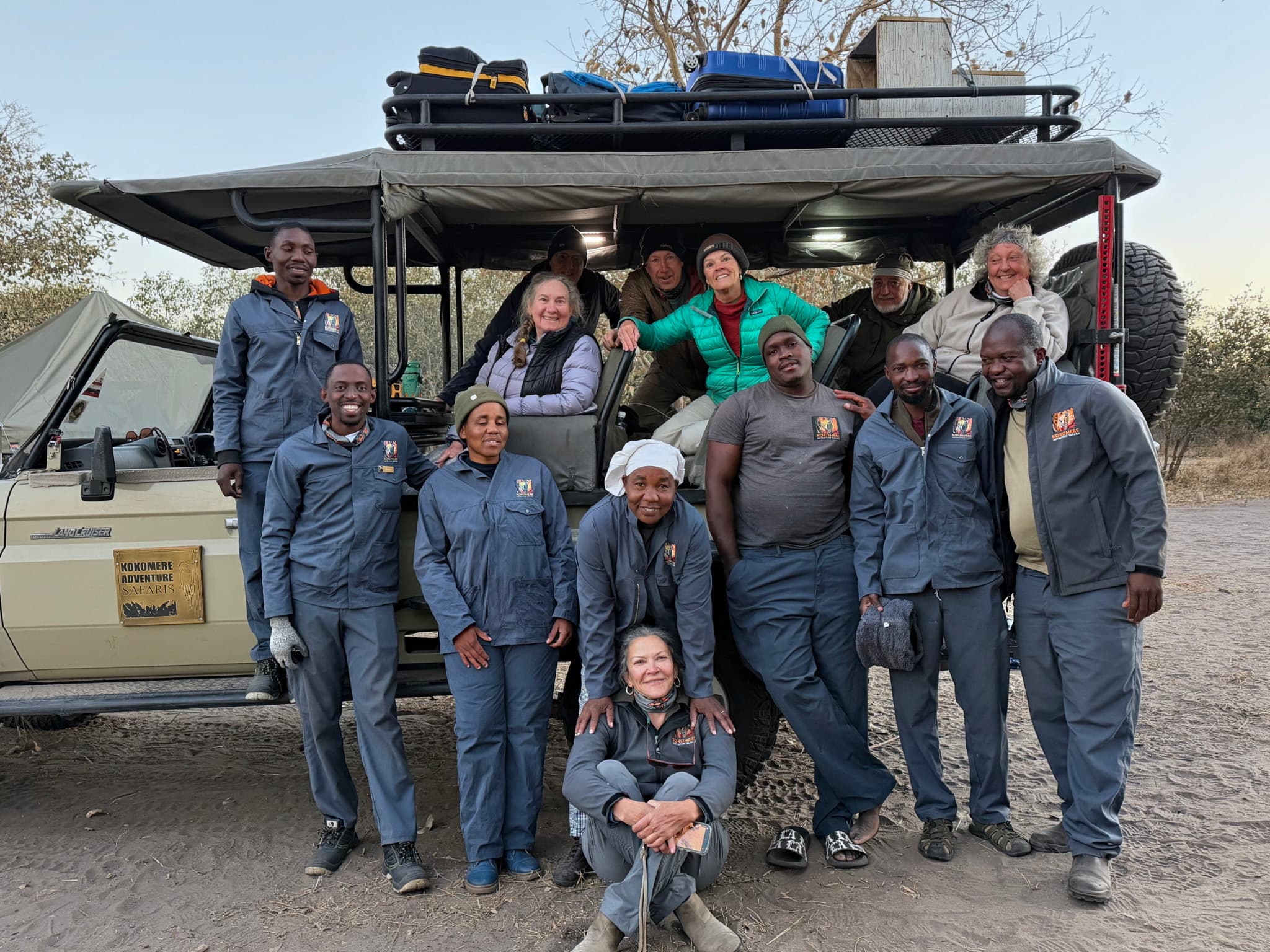 The full Kokomere Adventure Safaris team and crew in front of the safari vehicle